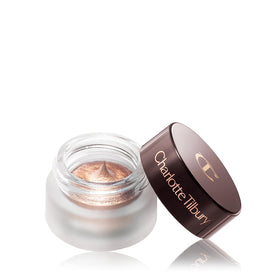 Charlotte Tilbury pot next to luxury palette showing layering potential for richer color