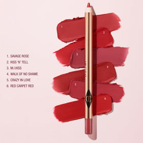 Charlotte Tilbury pencil beside hand showing length and travel-friendly size