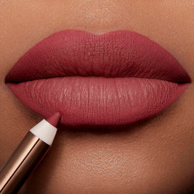 Charlotte Tilbury pencil paired with lipstick to show layering and color match