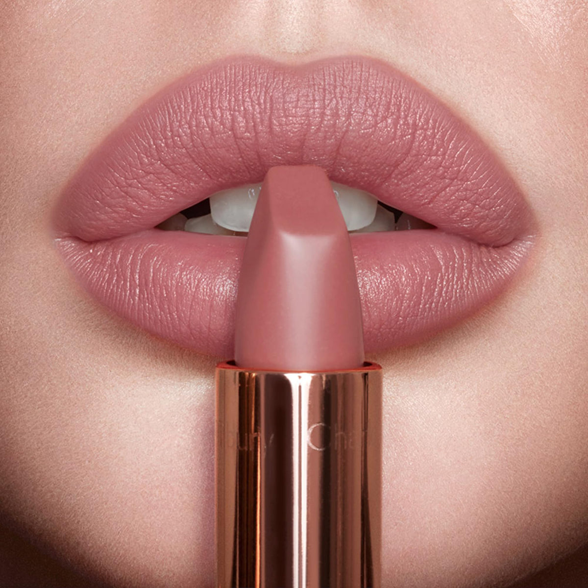 Charlotte Tilbury Pillow Talk on model smiling to show natural enhancement