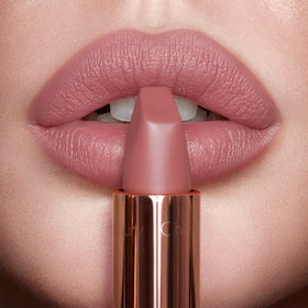 Charlotte Tilbury Pillow Talk on model smiling to show natural enhancement
