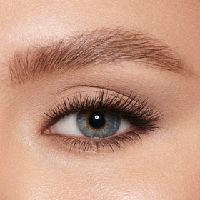 Size comparison of Charlotte Tilbury Legendary Brows next to fingers for scale
