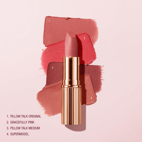 Charlotte Tilbury lipstick beside a coin showing compact size and travel convenience benefit