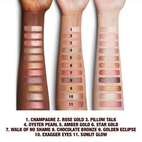 Charlotte Tilbury pot beside finger to show true scale and travel-friendly convenience