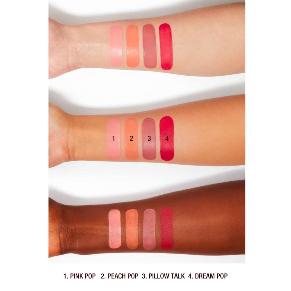 Charlotte Tilbury wand beside brush to show compact, travel-ready size