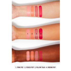 Charlotte Tilbury wand beside brush to show compact, travel-ready size