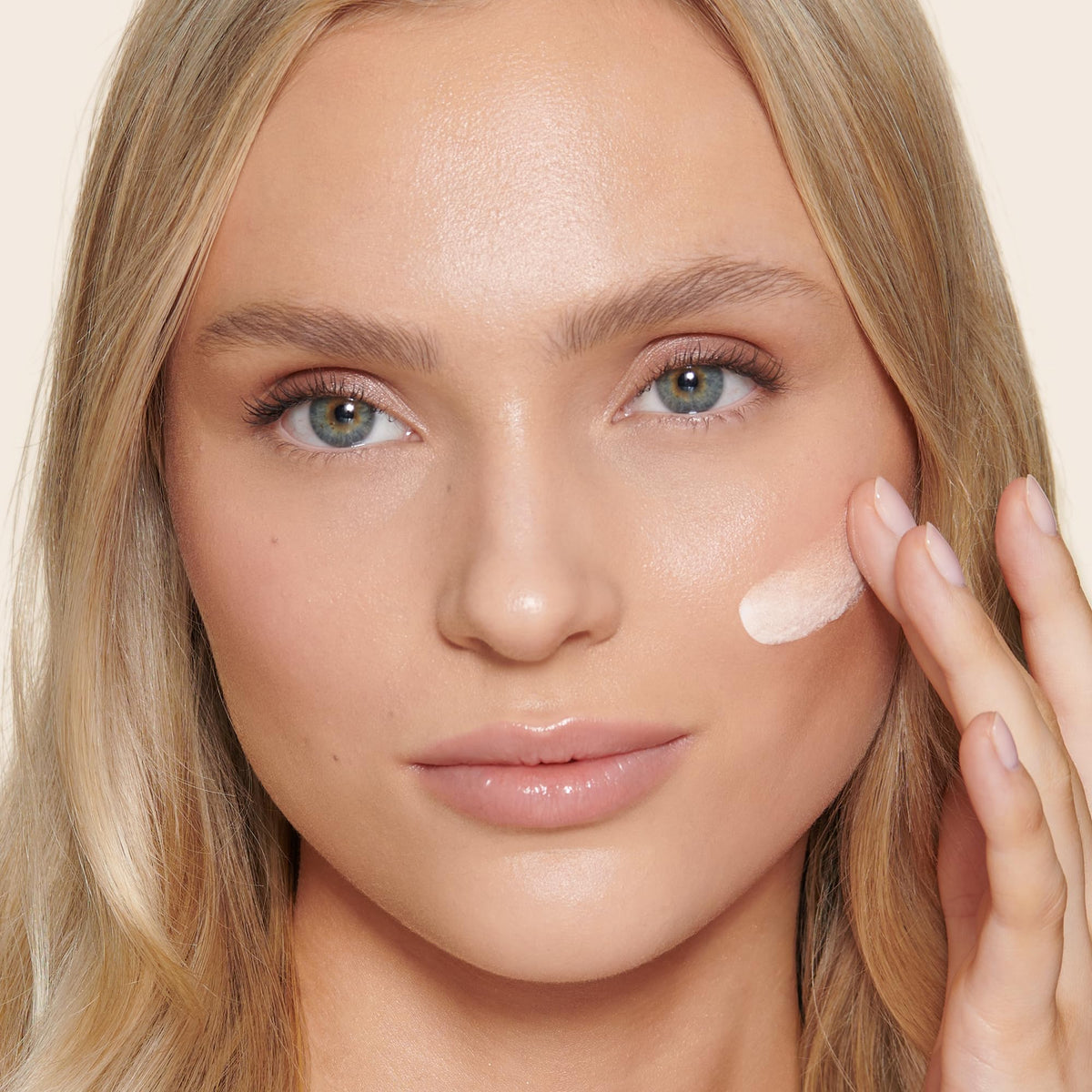 Charlotte Tilbury skin tint in hand for size comparison, illustrates travel-friendly convenience