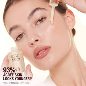 Charlotte Tilbury 8ml serum tucked into cosmetic bag highlighting portability and on-the-go use