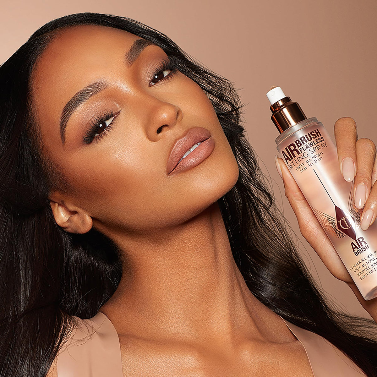 Charlotte Tilbury in travel pouch emphasizing convenience and durability benefit
