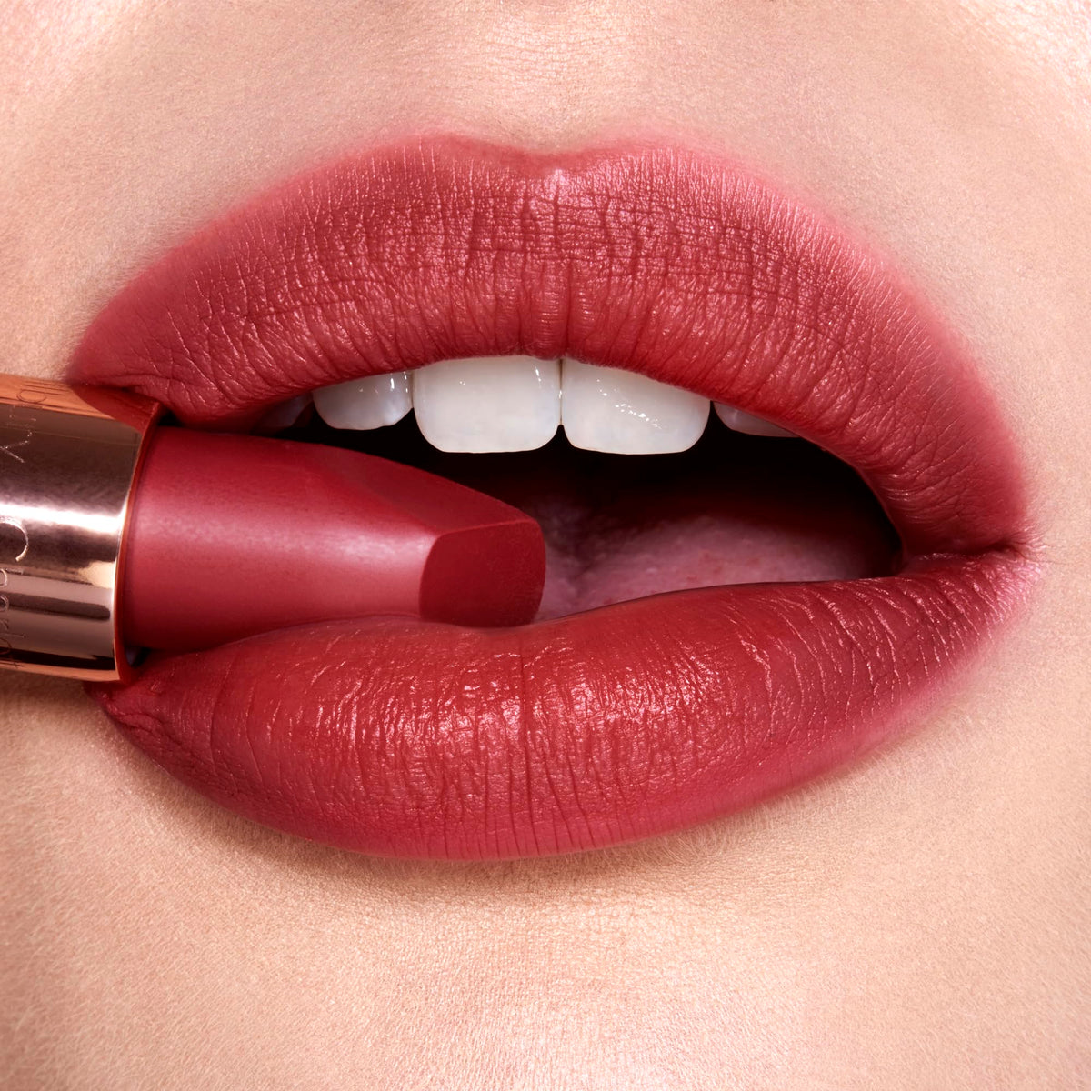 Charlotte Tilbury model applying Walk Of No Shame lipstick for polished everyday look
