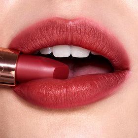 Charlotte Tilbury model applying Walk Of No Shame lipstick for polished everyday look