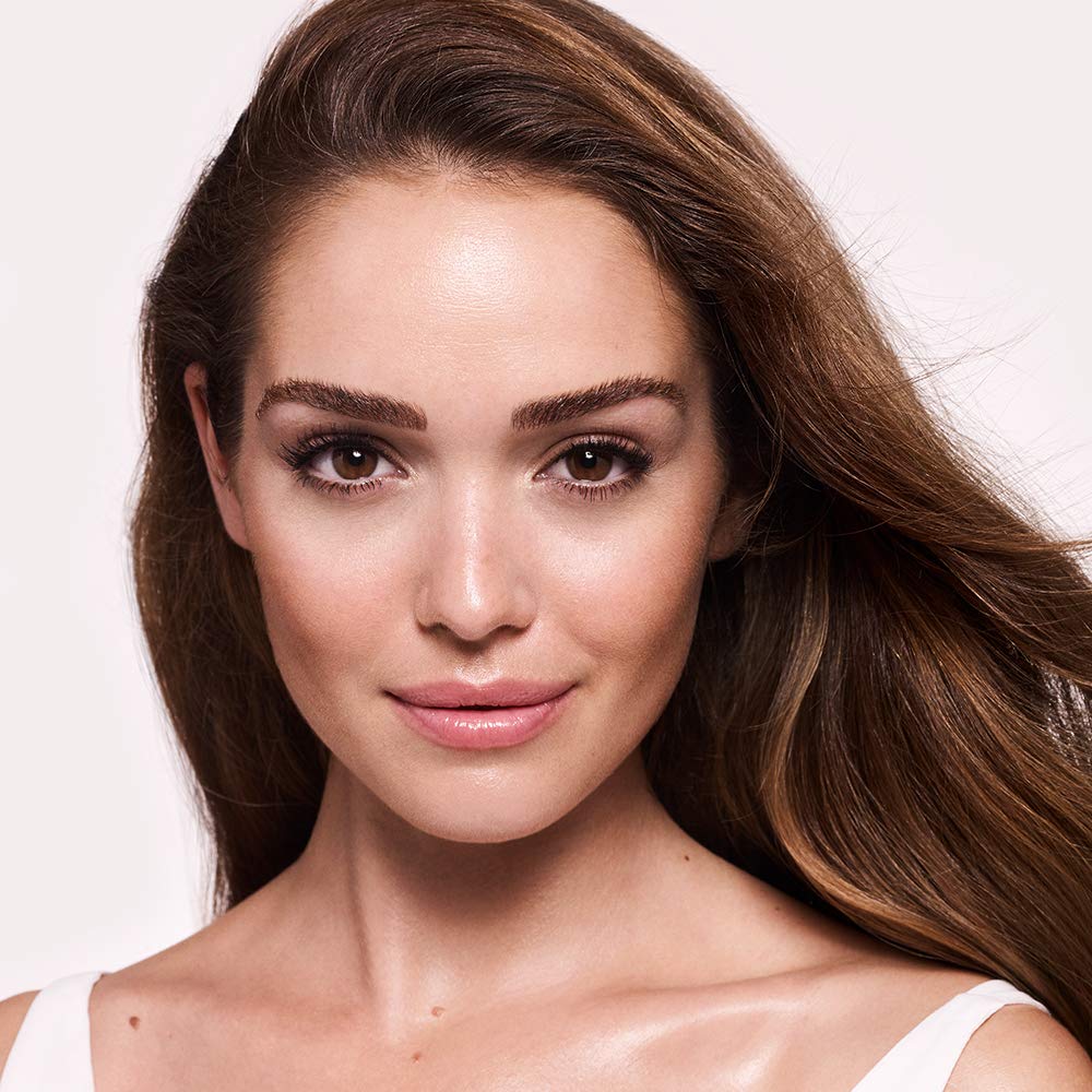 Charlotte Tilbury Wonderglow layered under foundation for improved glow and smoother makeup