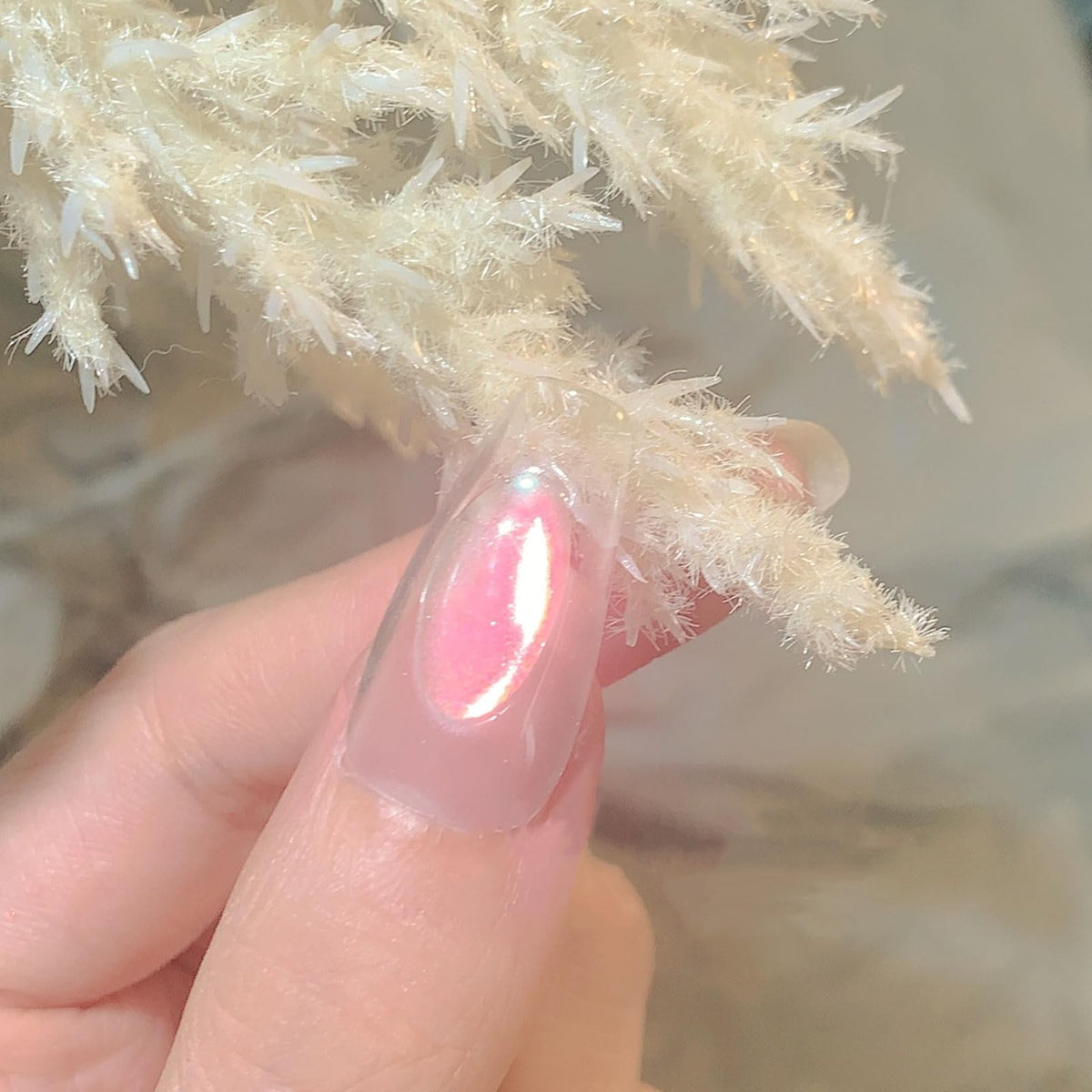 CHARMING MAY polished hands wearing aurora nails demonstrating professional-looking shine