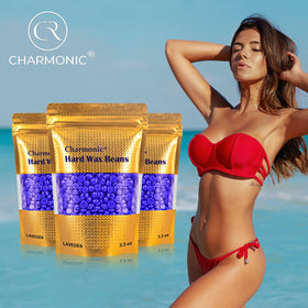 Charmonic included applicator sticks next to wax beads for easy DIY waxing