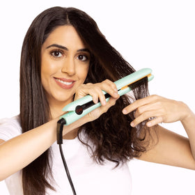 CHI flat iron on bathroom vanity in lifestyle scene showing professional results at home benefit