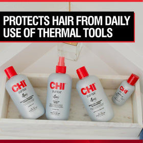 Stylist applying CHI Infra to damp hair before blow-dry for heat defense