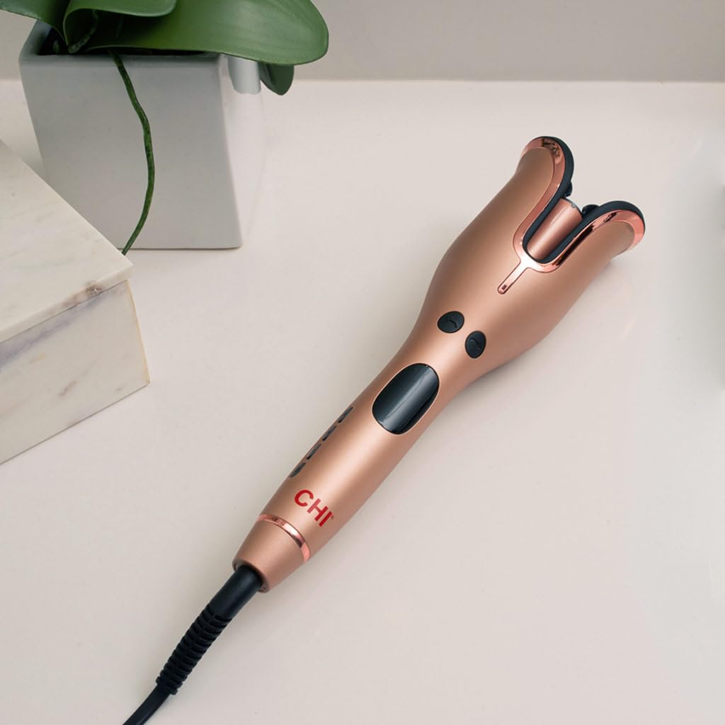 CHI in-use on long hair illustrating automatic curling action for quick, even waves