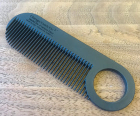 Chicago Comb Model 2 next to ruler illustrating 4 inch length for accurate scale