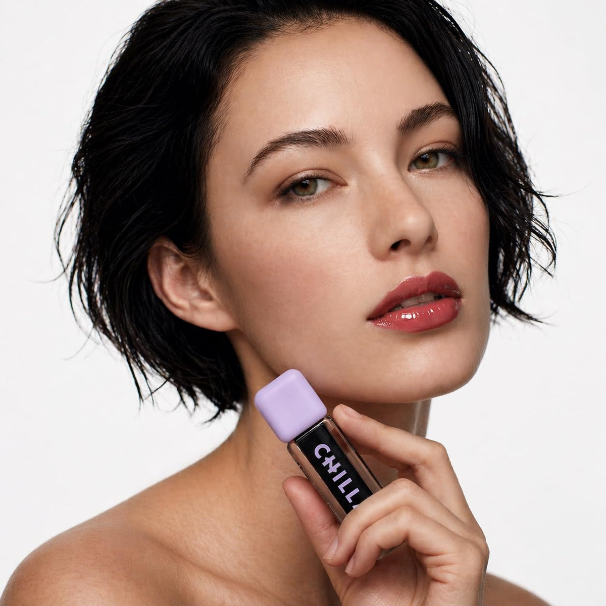 Chillab applicator close-up displaying smooth gloss texture and easy application