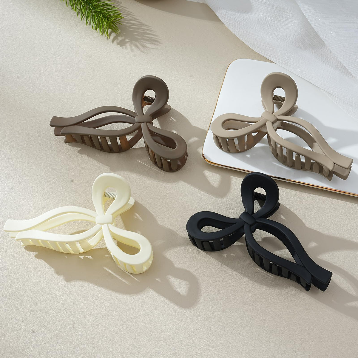 CHLINS color collection flatlay showing black, brown, off-white options
