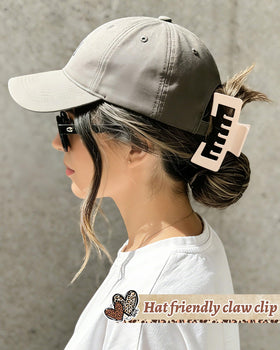 CHLINS clip inserted through cap strap demonstrating fit and hands-free comfort