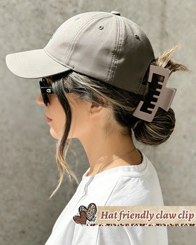 CHLINS model wearing trucker cap with clip in place, comfortable hands-free hair control benefit