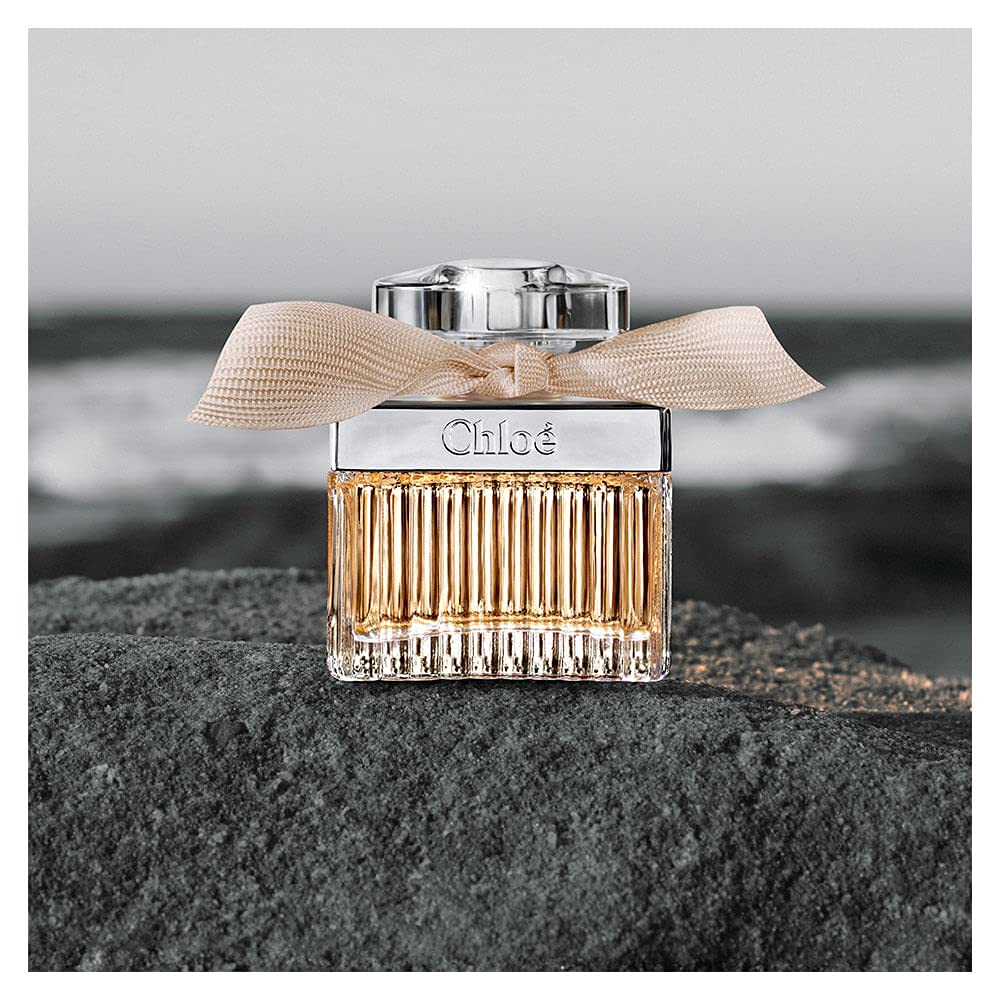 Chloe New By Chloe staged on vanity in romantic setting conveying evening-ready elegance