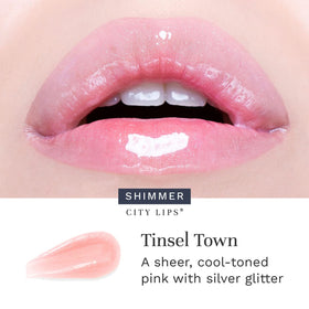 City Beauty swatch on lips demonstrating full-shine sparkle and plumping effect