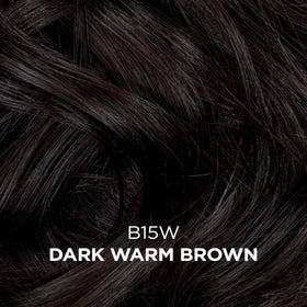 Clairol Professional color being dispensed onto a hair strand to demonstrate even saturation and coverage