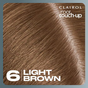 Clairol in mirror lifestyle shot emphasizing quick at-home touch-up benefit