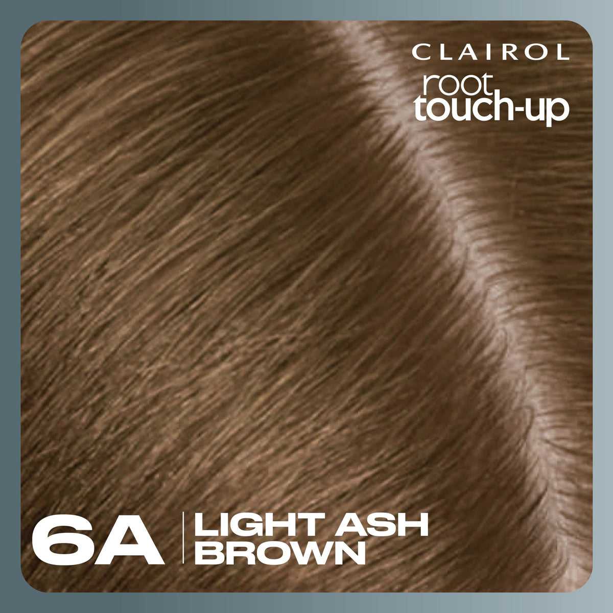 Clairol lifestyle shot of woman checking hair in mirror after touch-up for confidence