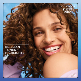 Styled model hair after Clairol treatment showing luminous natural color