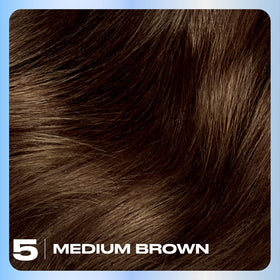Close up of Clairol color cream texture illustrating smooth oil‑infused formula