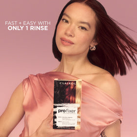 Clairol Pro Fixer kit next to hand to show scale and portions