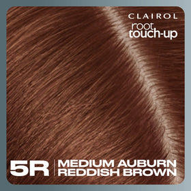 Clairol applied by user at mirror for fast at-home touch-up convenience