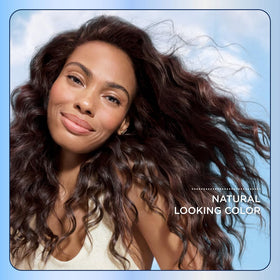 Clairol box next to hairbrush showing pack size and home use scale