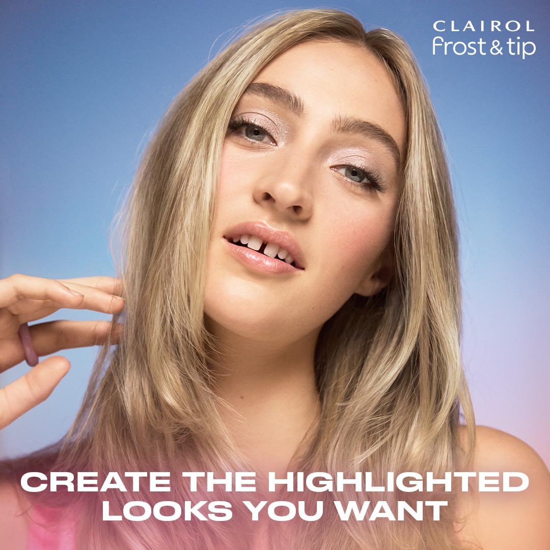 Clairol kit beside a hand to show compact size and travel-friendly benefit