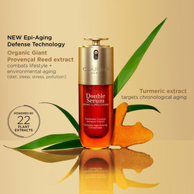 Clarins DOUBLE SERUM next to a ruler showing 1 fl oz size for scale and portability