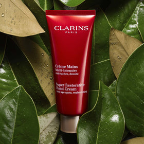 Clarins hand cream being applied to hands demonstrating improved softness