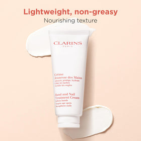 Clarins hand cream next to everyday objects showing 3.4 oz scale and travel-friendly benefit