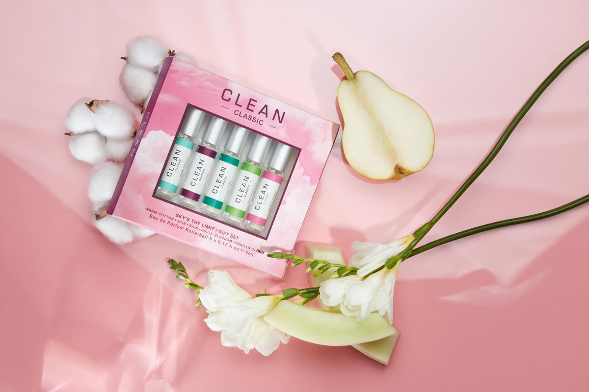 CLEAN lifestyle scene outdoors with rollerballs on a picnic showing mood-lifting portability benefit