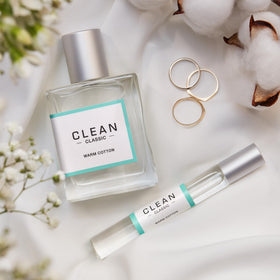 CLEAN Classic on a linen bedspread suggesting cozy fresh-smelling sheets benefit
