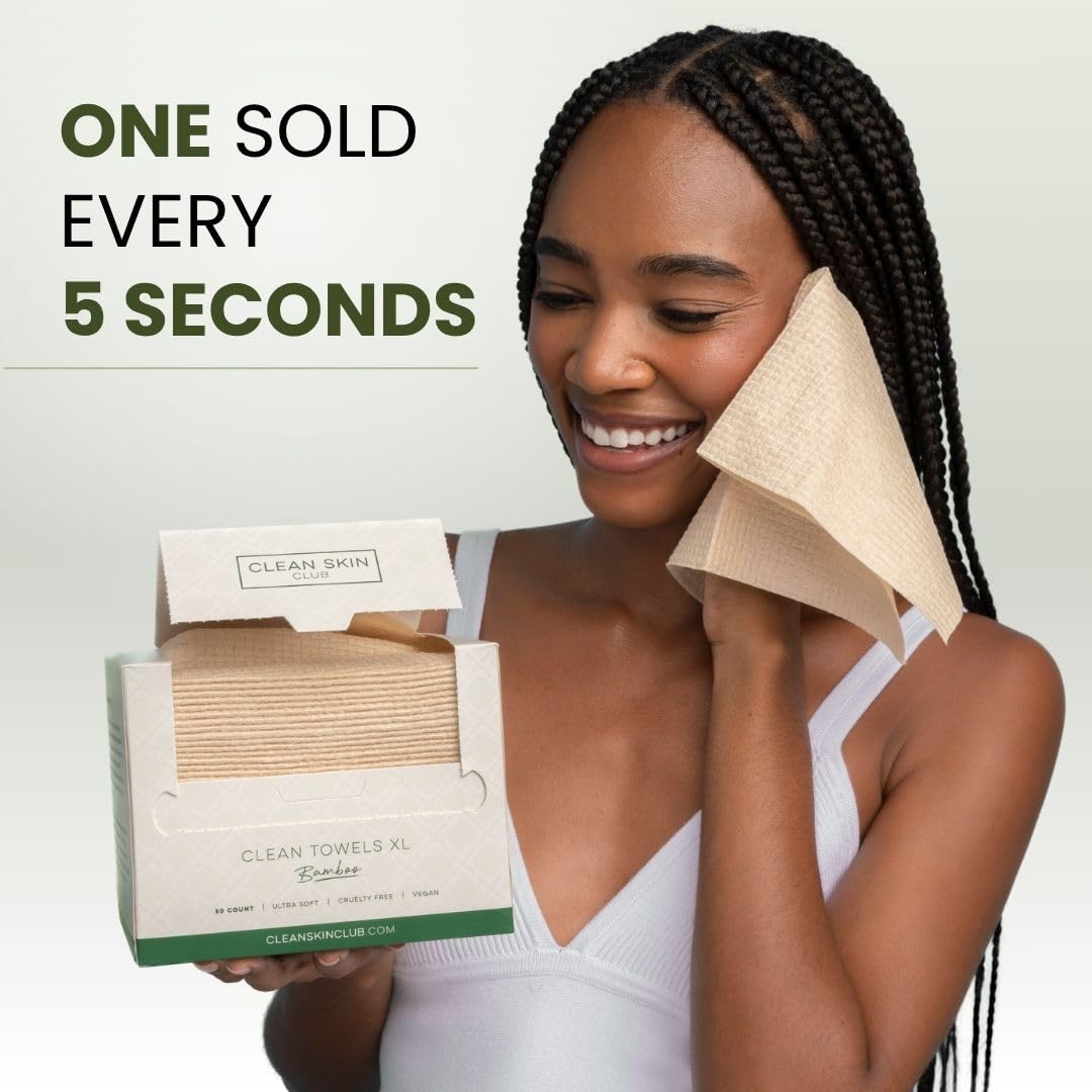 Clean Skin Club towel held in hand to show scale and comfortable handling
