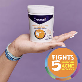 Clearasil tub placed on bathroom counter for daily routine visibility
