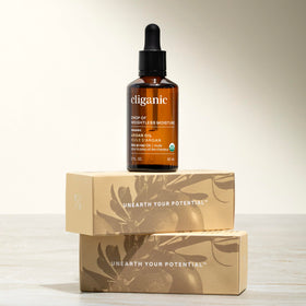 Cliganic argan oil label close-up featuring USDA Organic and non-GMO verification benefit