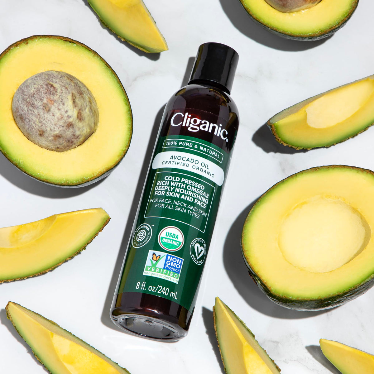 Close-up pour of Cliganic oil highlighting smooth texture and nourishing feel