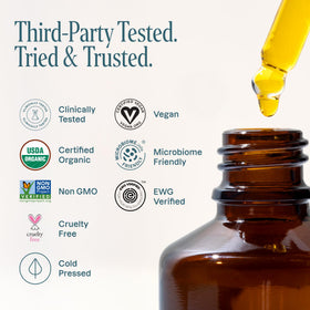 Cliganic jojoba oil label with organic certifications visible — trusted purity benefit