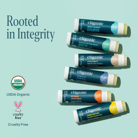 Cliganic lip balms in a purse outdoors highlighting travel convenience