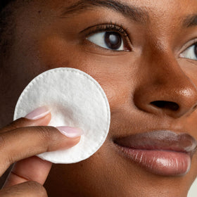 Cliganic pad held in hand showing size and gentle absorbency
