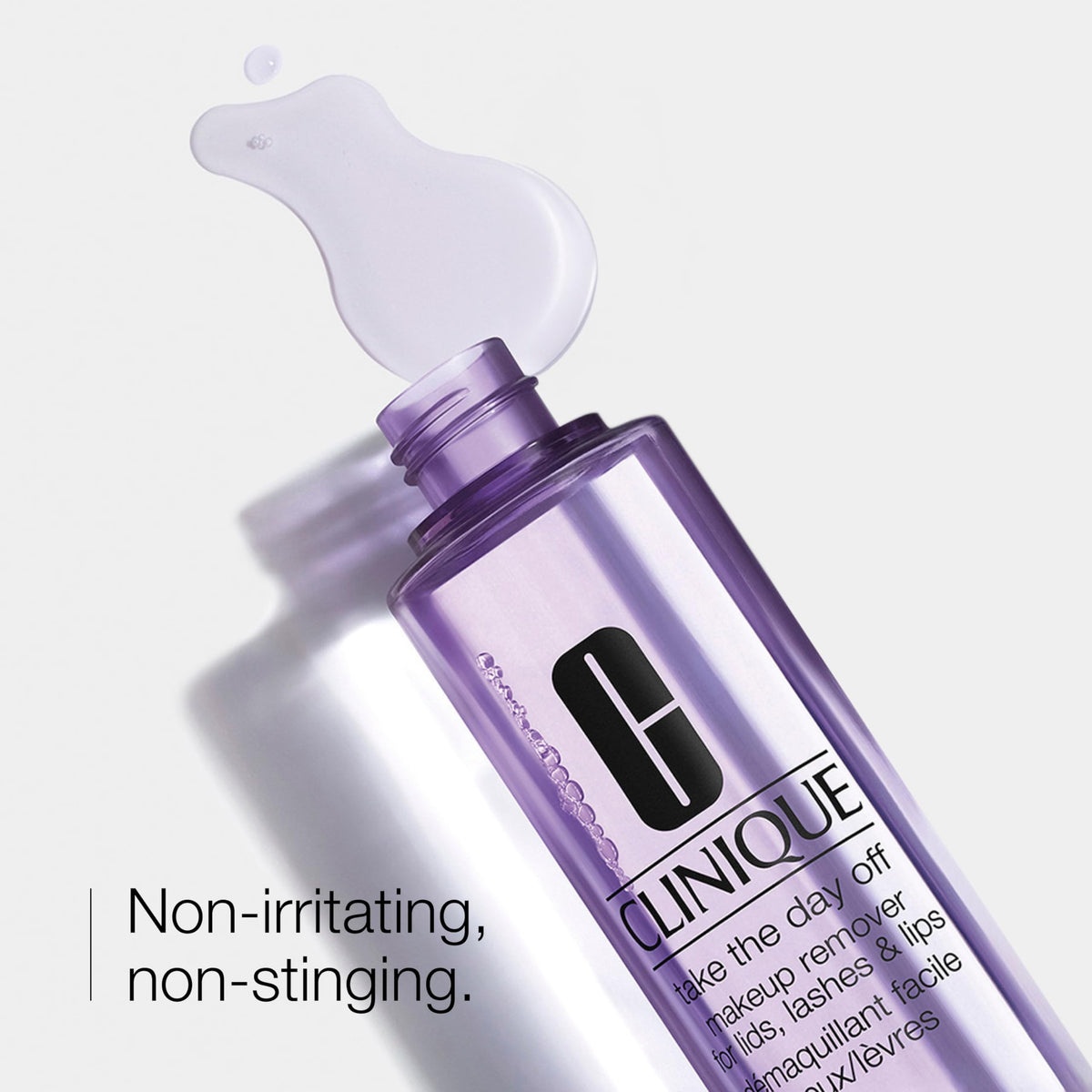Clinique bottle next to ruler showing 4.2 fl oz size and travel convenience